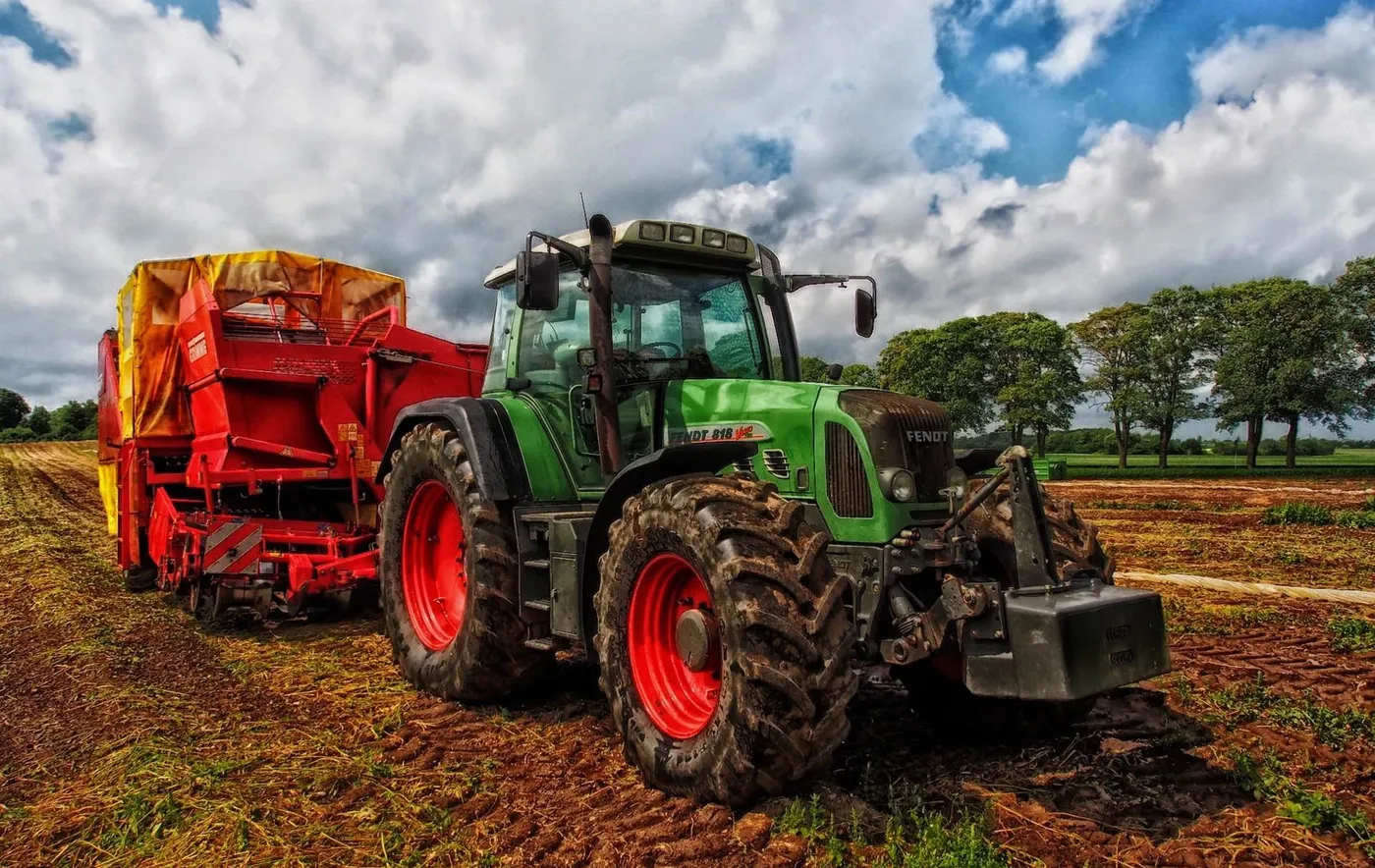 A green tractor in a field